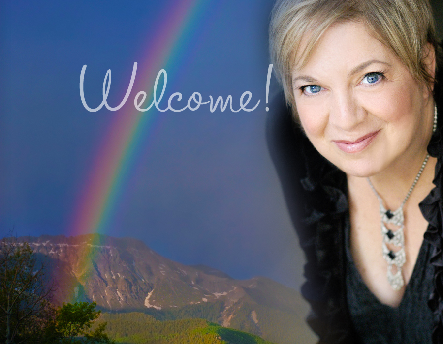 photo of adorable woman with pixie haircut superimposed over rainbow sky